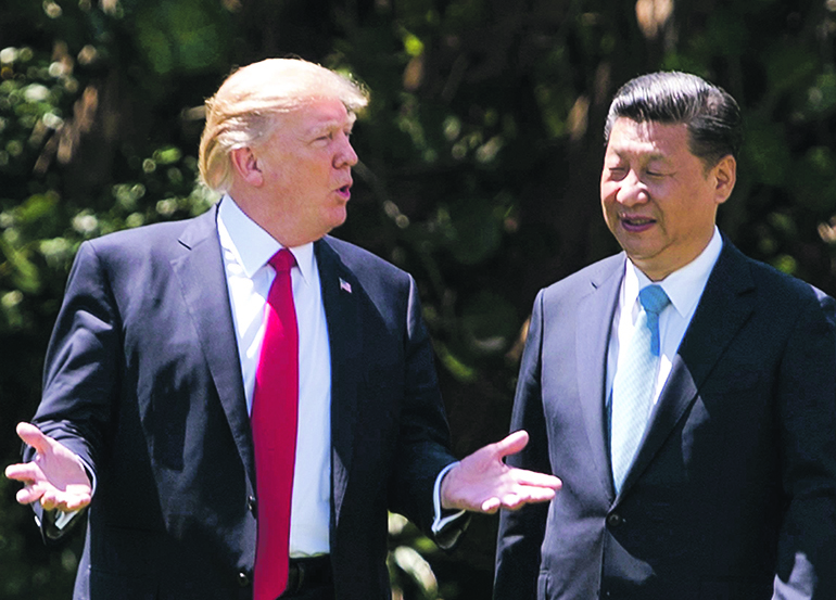 Guerra comercial à espera de encontro entre Trump e Xi Jinping